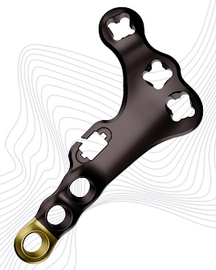Black metal hand grip trainer with four finger holes and a gold ring at one end, used to exercise grip strength by placing fingers in the holes and squeezing.